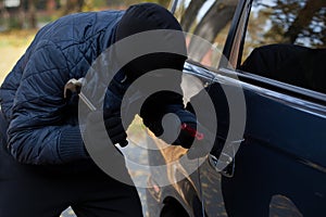 Masked burglar with hammer