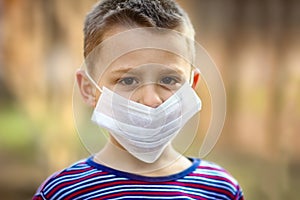 Masked child from coronavirus and air. Protection against PM 2.5 air polluted from the virus in Europe