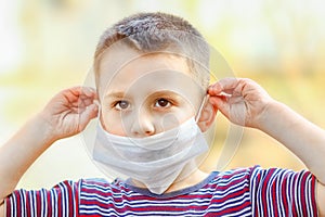 Masked child from coronavirus and air. Protection against PM 2.5 air polluted from the virus in Europe