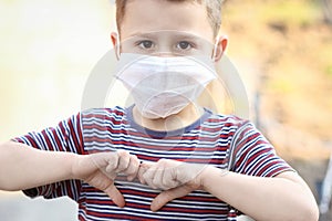 masked child from coronavirus and air. Protection against PM 2.5 air polluted from the virus in Europe