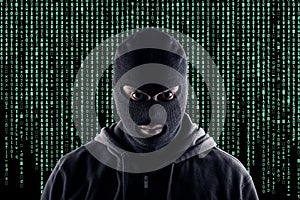 Masked cyber terrorist with black balaclava and hoodie