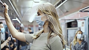 Masked face woman carriage subway corona virus. Crowd passengers train covid-19.