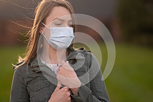 Masked girl on an empty street in the USA. Coronavirus. Pandemic epidemic. Disease outbreak. Media and news publishers