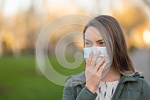 Masked girl on an empty street in the USA. Coronavirus. Pandemic epidemic. Disease outbreak. Media and news publishers