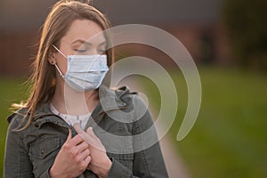 Masked girl on an empty street in the USA. Coronavirus. Pandemic epidemic. Disease outbreak. Media and news publishers