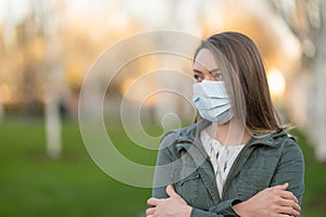 Masked girl on an empty street in the USA. Coronavirus. Pandemic epidemic. Outbreak of illness. Media and news publishers, ban on