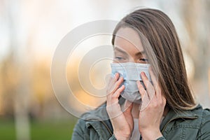 Masked girl on an empty street in the USA. Coronavirus. Pandemic epidemic. Outbreak of illness. Media and news publishers, ban on