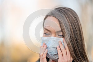 Masked girl on an empty street in the USA. Coronavirus. Pandemic epidemic. Outbreak of illness. Media and news publishers, ban on