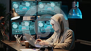 Masked hacking thief stealing information from database server