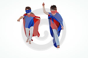 Masked kids walking pretending to be superheroes