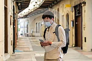 Masked male tourist walks at closed market during coronavirus pandemic, lockdown on Cyprus. Man in mask walks through