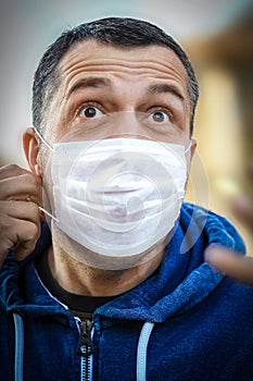 Masked man from coronavirus and air. Protection against PM 2.5 air polluted from thea  virus in Europe and Asia