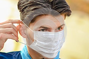 Masked man from coronavirus and air. Protection against PM 2.5 air polluted from thea  virus in Europe and Asia