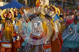 Masked Morenada dancer at the Arica Carnival