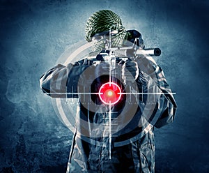 Masked terrorist man with gun and laser target on his body