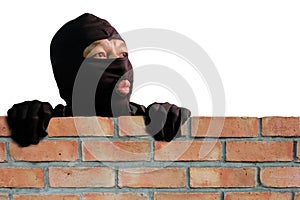 Masked thief is climbing the wall to steal property in the house, Detecting CCTV camera surveillance of home security systems