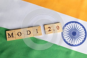 MAski, India - June, 09 2019 : Modi 2.0 wooden block letters on Indian Flag