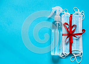 Masks and antiseptics on a blue background.