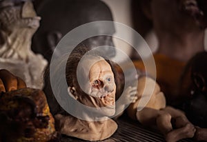 Masks and dummies on a shelf