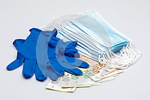 Masks, gloves and money isolated on white