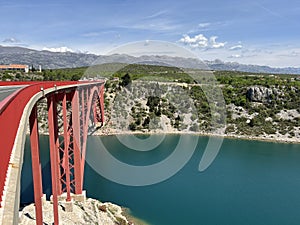 The Maslenica Bridge, a deck arch bridge carrying the D8 state road spanning the Novsko Zdrilo strait (Croatia) photo