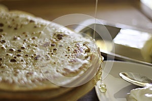 Maslenitsa. A stack of yeast pancakes on a blurred background