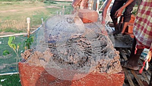 A Mason bricklayer installing bricks on construction site.