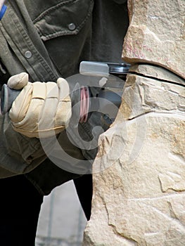 Mason cutting sandstone