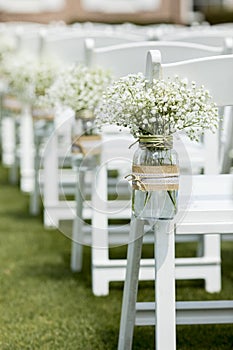 Mason jar and flowers at wedding