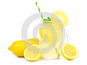 Mason jar of lemonade with lemons and straw over white photo