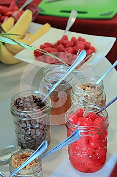 Mason jars filled with toppings for ice cream sundaes