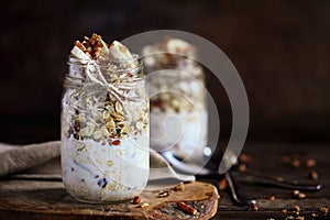 Mason Jars of Overnight Oatmeal with Bananas and Pecan Nuts photo