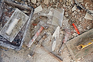 Mason tools on debris background