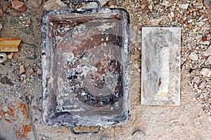 Mason tools on debris background