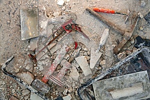 Mason tools on debris background