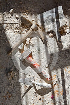 Mason tools on debris background