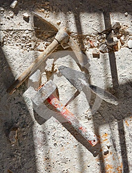 Mason tools on debris background