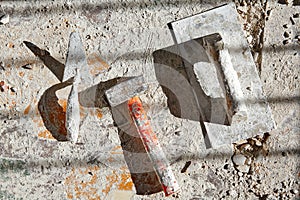 Mason tools on debris background
