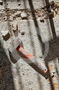 Mason vintage hammer tool on debris