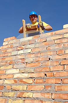 Mason on wooden ladder