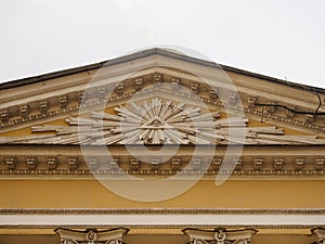 Masonic symbol on the wall church. The eye of God in the center of the pyramid rises above the mortal worlds in the rays of the