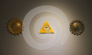 Masonic symbols on white wall in museum