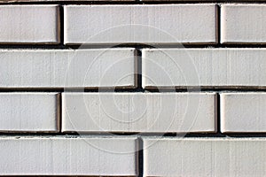 Masonry of beige bricks close up