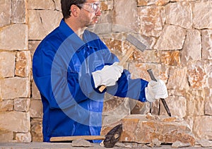 Masonry mason stonecutter man with hammer working