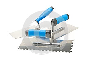 Masonry tools - trowels and notched trowel - on white