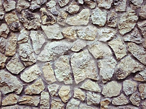 Masonry wall. Textured background of stones, handmade