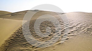 Maspalomas Dunes in Gran Canaria, Spain, during a beautiful day with clear skies