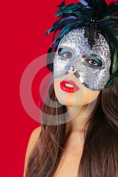 Masquerade mask red background