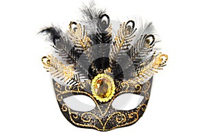 Masquerade mask with sparkles, jewel and feathers on a white background