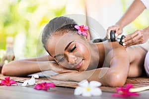 Massage of back with stone massage